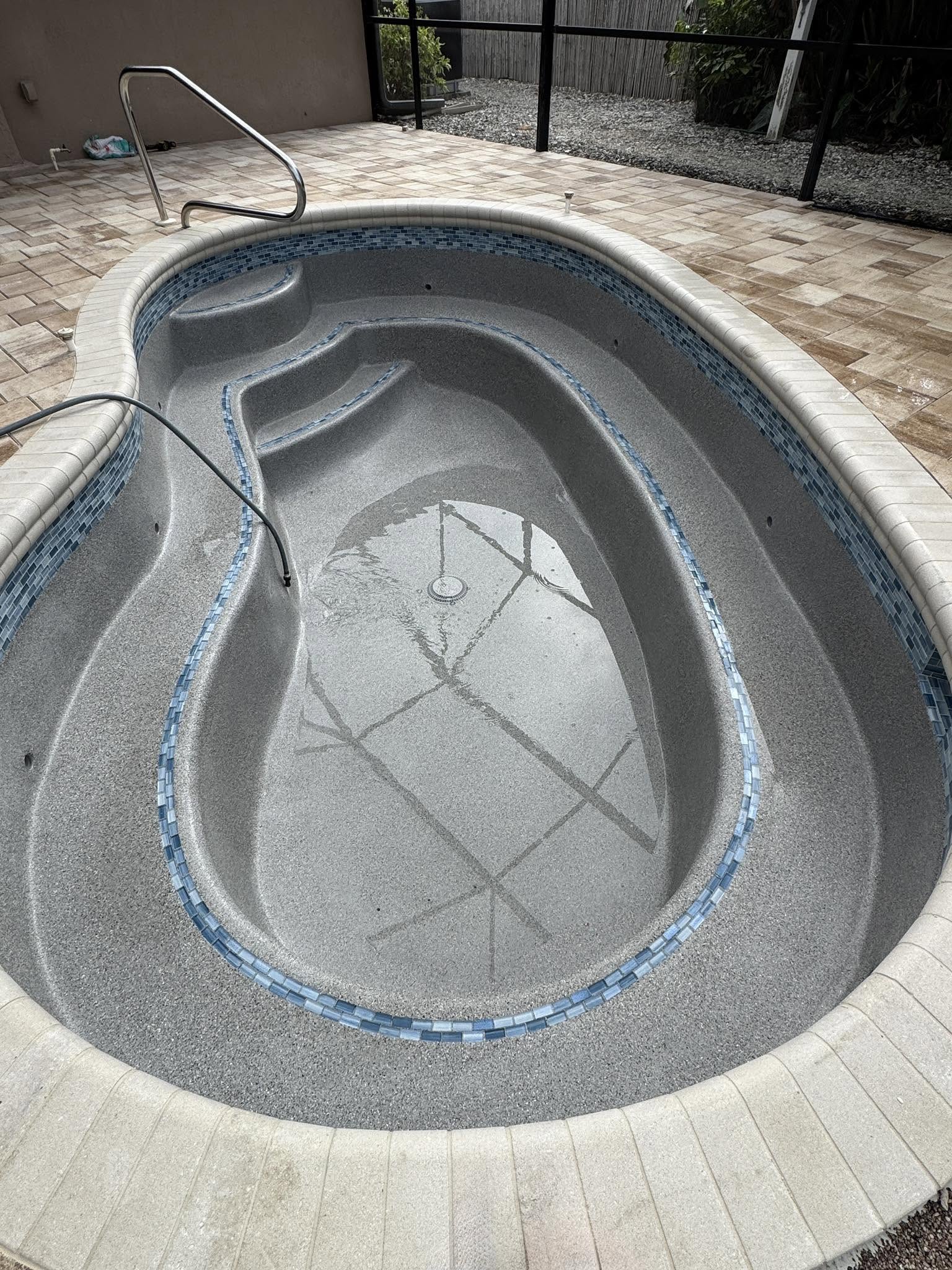 Port Charlotte pool resurfaced with French Gray Mini finish